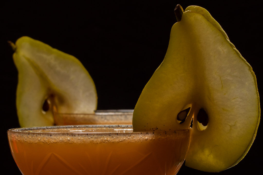 spiced ginger pear shrub: two glasses close up