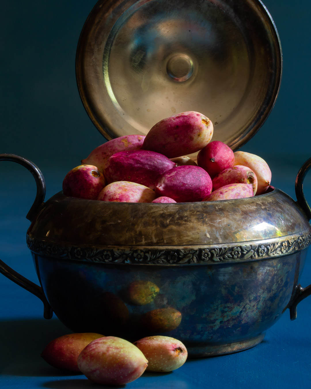 fresh pistachios in vintage sugar bowl